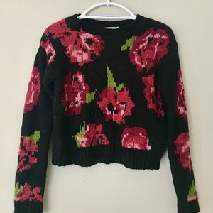 Francesca’s black sweater with roses